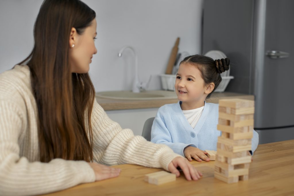 5 Everyday Activities That Build Your Toddler's Language front view mother girl playing game