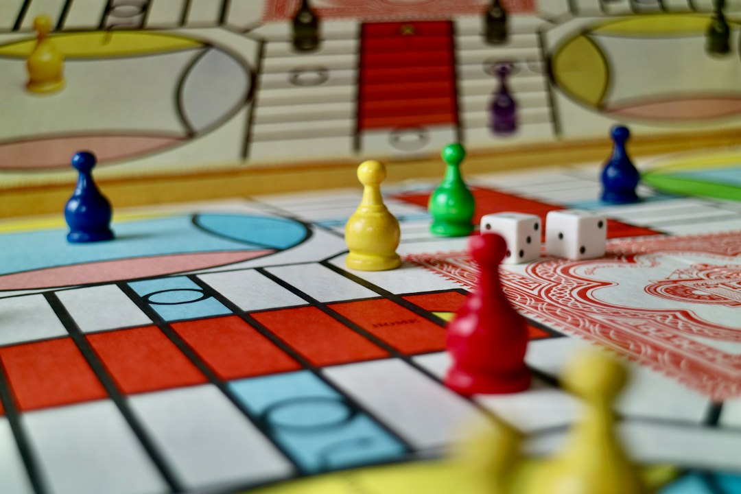 Learning Center A board game with colorful pieces and dice for turn-taking play